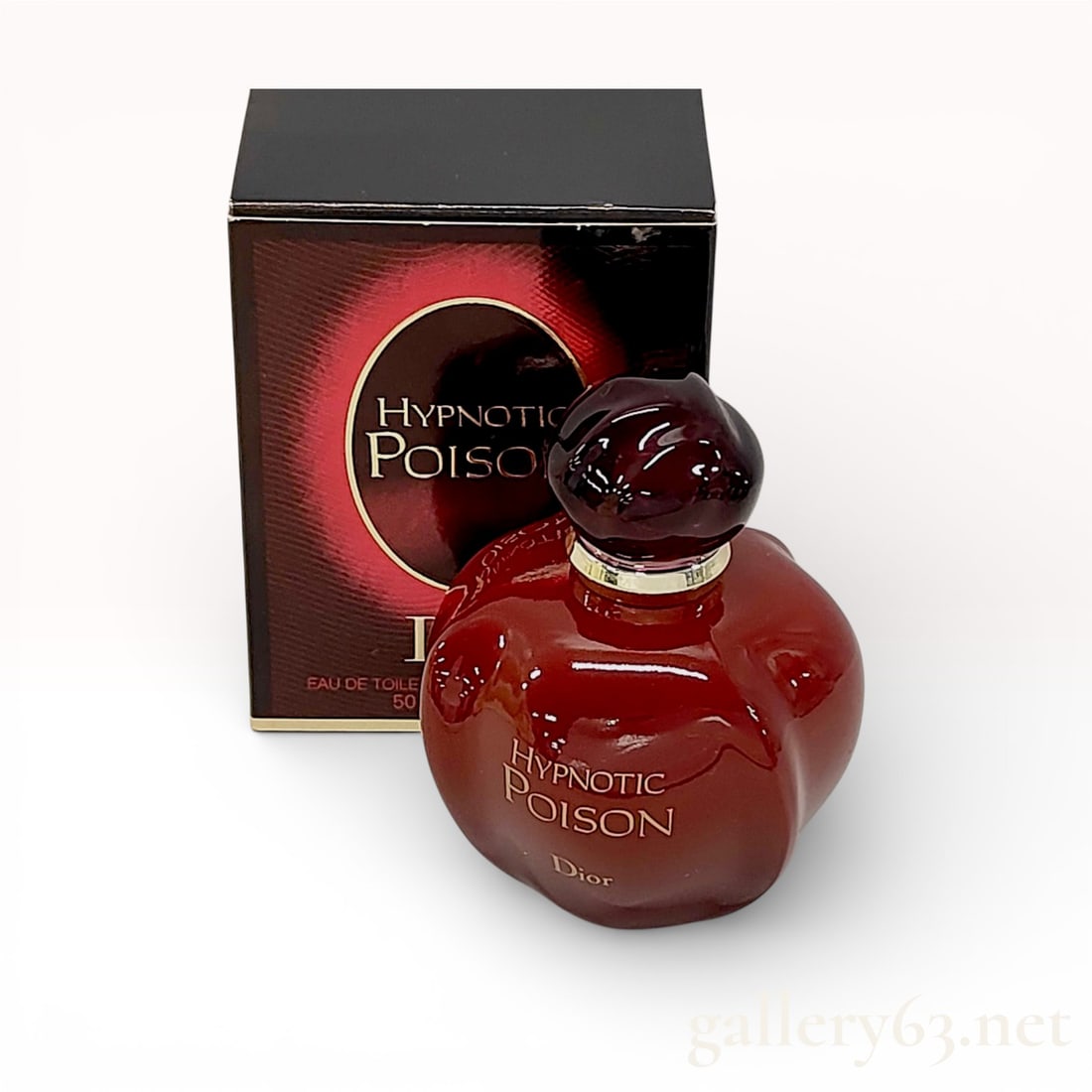 Christian Dior Hypnotic Poison Eau de Toilette 50ml Fragrance with Original Box: A 50ml bottle of Christian Dior Hypnotic Poison Eau de Toilette. The fragrance is housed in the signature rounded, opaque red glass bottle designed to resemble a forbidden fruit, featuring a dark tran