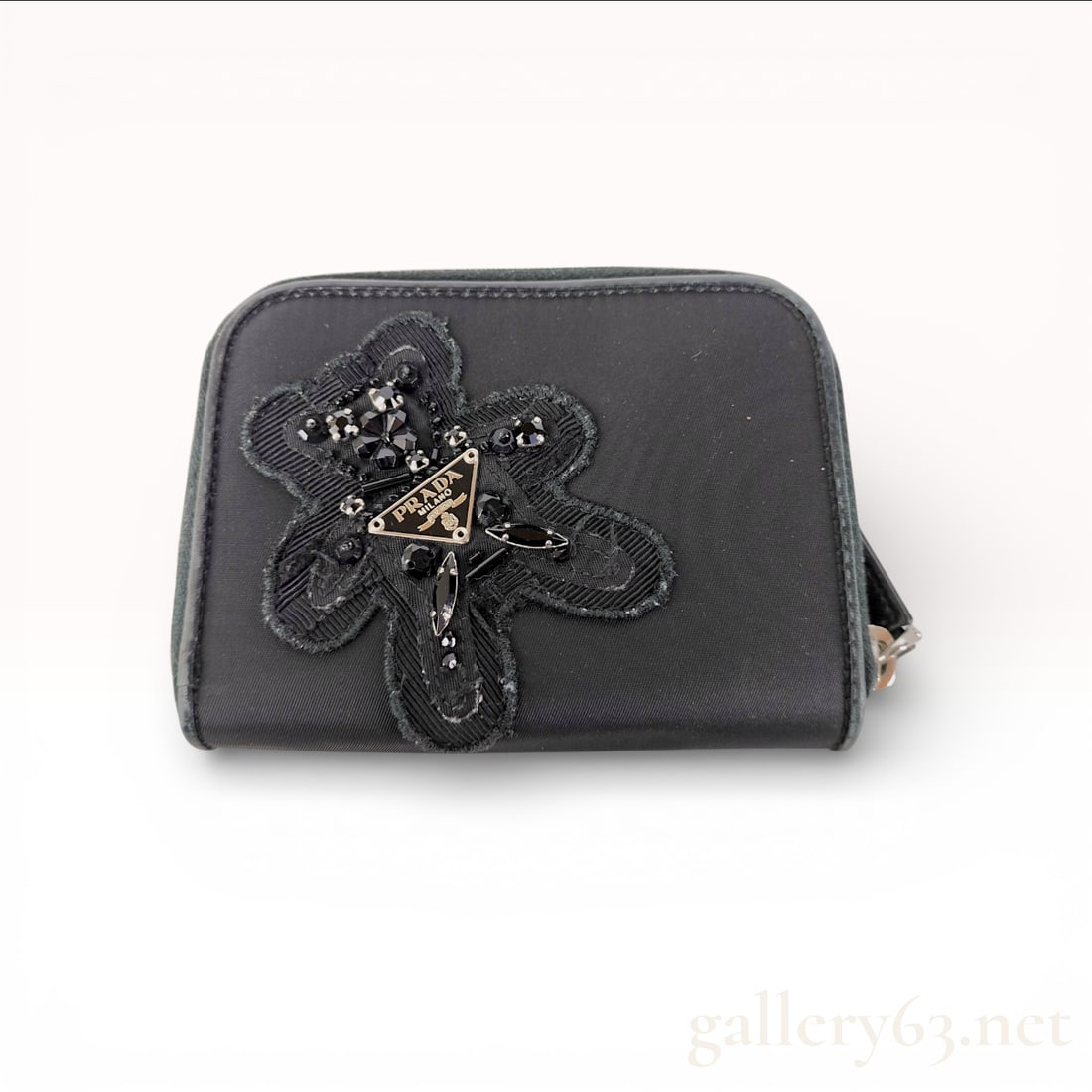 Prada Evening Bear Beaded Tessuto Nylon Bifold Wallet, Black: This Prada bifold wallet is crafted from signature black Tessuto nylon and features a decorative Evening Bear applique on the front. The bear motif is intricately detailed with faceted black beads and