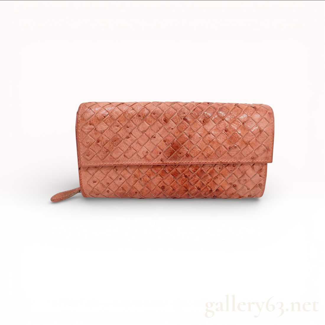 Bottega Veneta Intrecciato Ostrich Leather Long Flap Wallet, Salmon Pink: This Bottega Veneta long flap wallet is crafted from exotic ostrich leather featuring the house's signature Intrecciato hand-woven design. The exterior displays the characteristic quill follicles of t