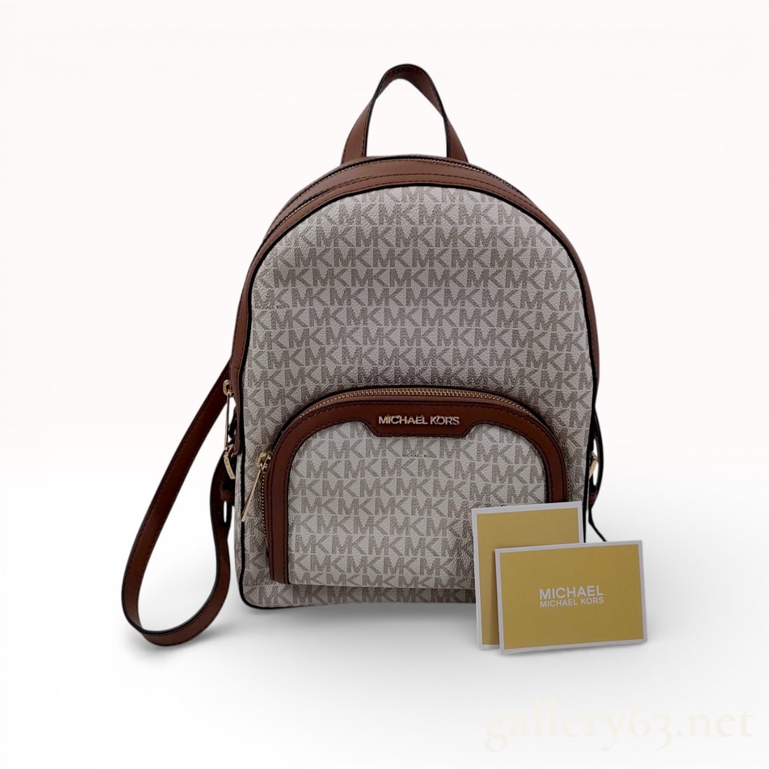 Michael Kors Jaycee Medium Logo Backpack, Coated Canvas, Vanilla and Acorn: A Michael Kors Jaycee medium backpack crafted from signature logo-print coated canvas in the Vanilla colorway with Acorn brown leather trim. The exterior features a dual-compartment zippered design wi