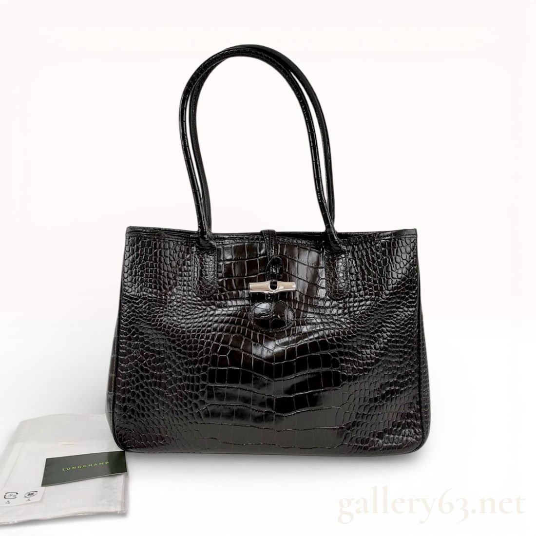 Longchamp Roseau Croco-Embossed Leather Tote, Black: A classic Longchamp Roseau tote crafted from glossy crocodile-embossed calfskin leather in black. This sophisticated piece features the line's signature silver-tone bamboo-shaped toggle closure. The i