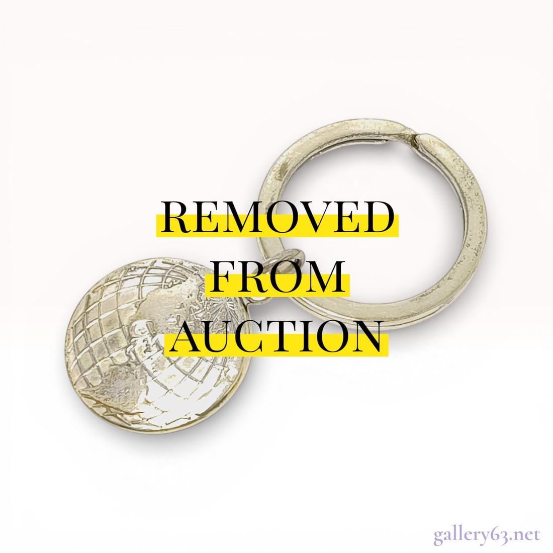 Tiffany & Co. Sterling Silver World Globe Keyring, circa 2000 with Box: This authentic Tiffany & Co. keyring is constructed from .925 sterling silver and features a circular charm with a raised, embossed world globe motif on the obverse. The split-ring is stamped TIFF