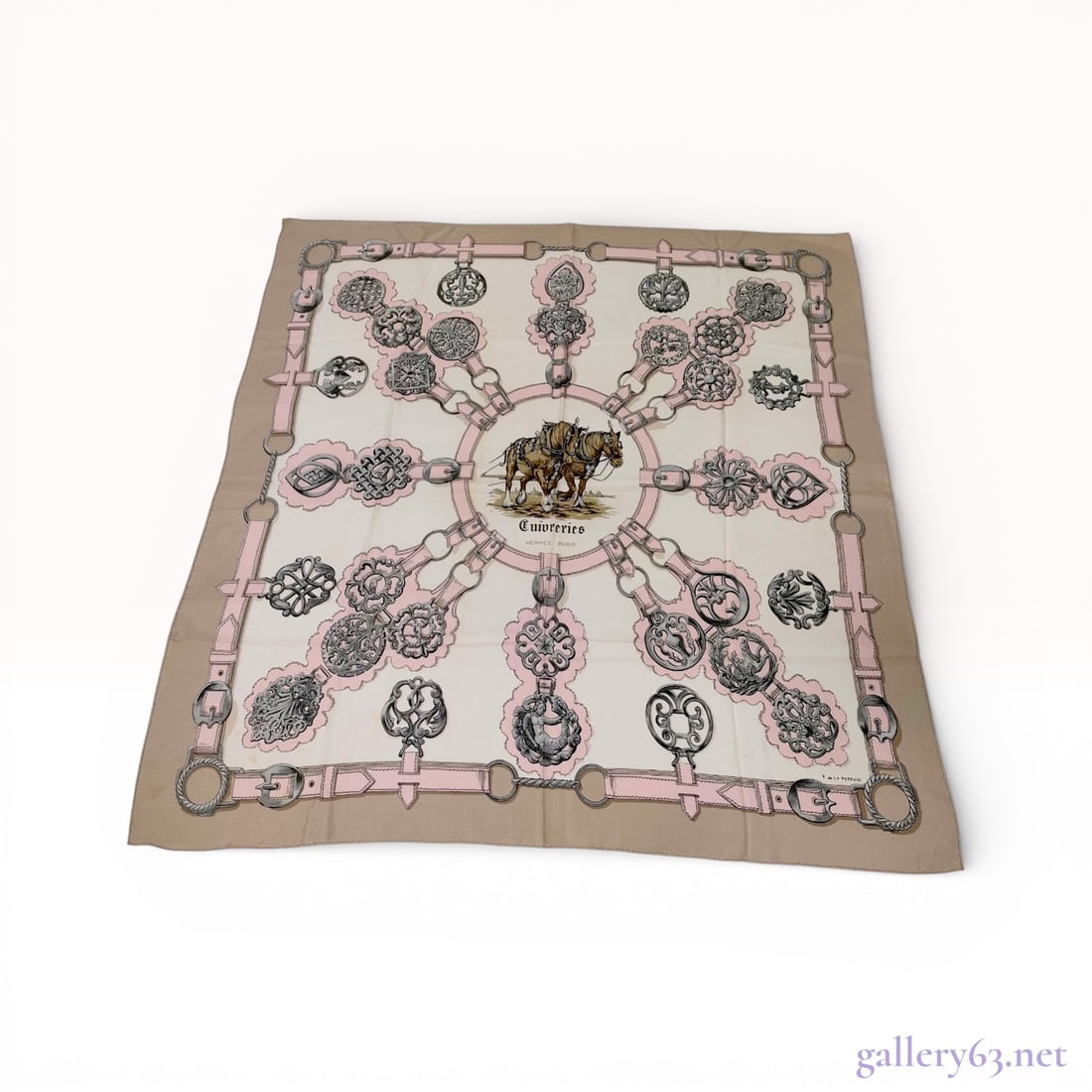 Hermes Silk Carre 90 Scarf in Cuivreries Pattern: This authentic Hermes silk scarf features the Cuivreries pattern, originally designed by Françoise de la Perrière. The equestrian-themed composition is centered on a vignette of two