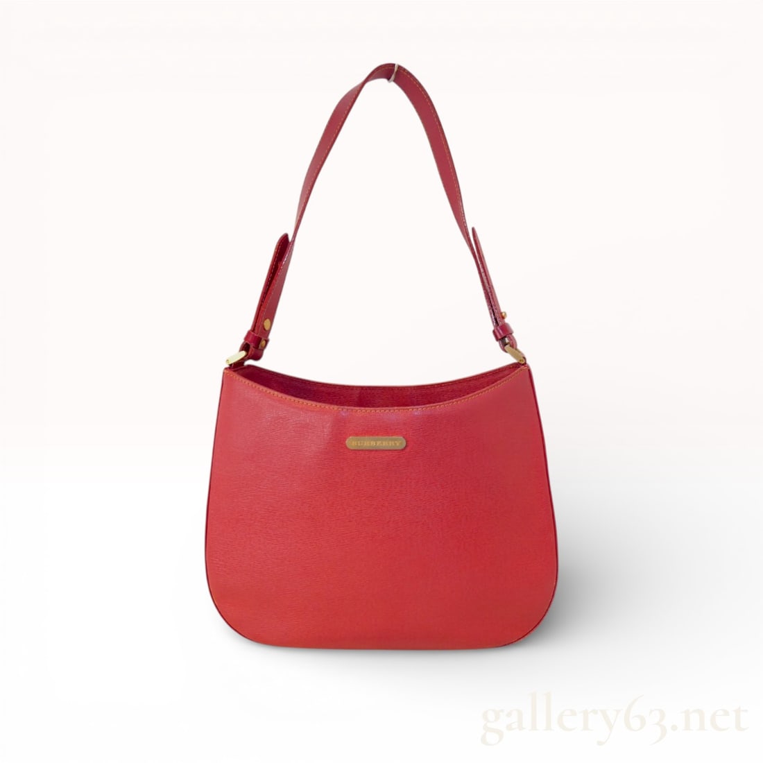 Burberry Structured Hobo Shoulder Bag, Red Crossgrain Leather: This elegant Burberry shoulder bag is crafted from a vibrant red crossgrain leather, providing both durability and a sophisticated texture. It features a structured, semi-oval silhouette with a smooth
