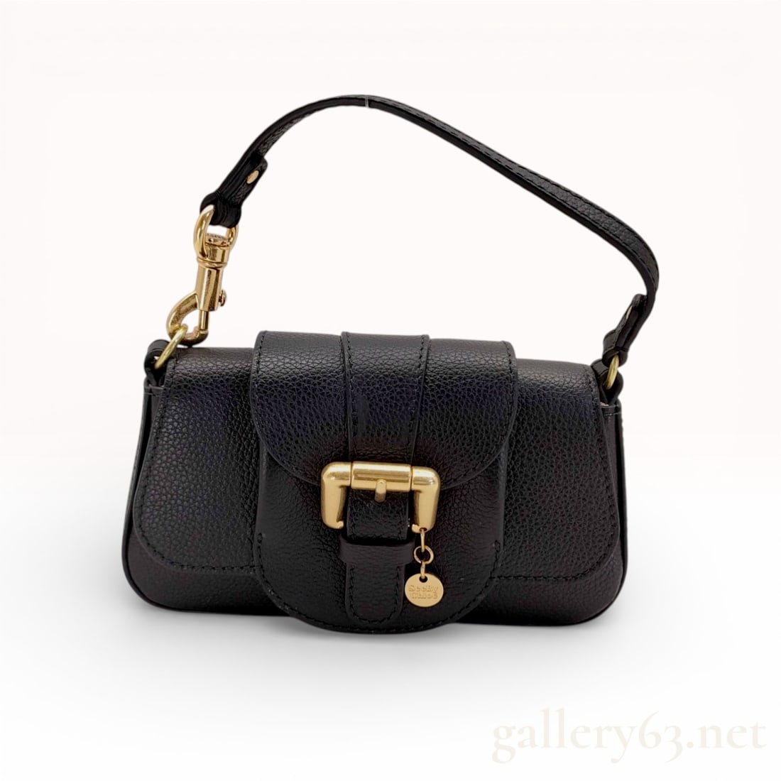 See By Chloe Lesly Mini Grained Leather Shoulder Bag, Black: This See By Chloe Lesly mini shoulder bag is crafted from black grained leather with a structured baguette silhouette. The exterior features a front flap with a magnetic closure and a prominent decora