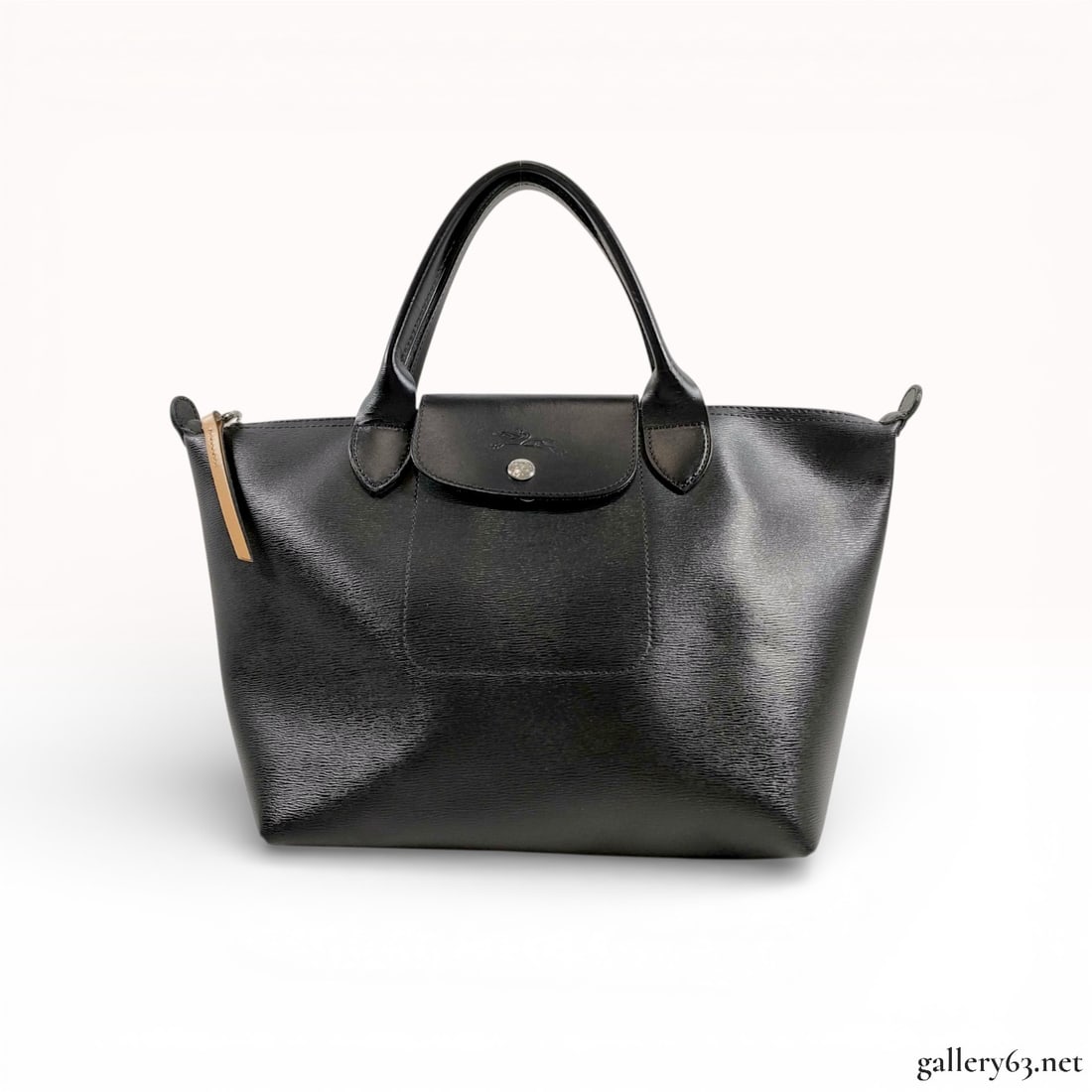 Longchamp Le Pliage Structured Leather Tote, Black: This Longchamp tote is crafted from black fine-grained textured leather, featuring the classic Le Pliage silhouette. The exterior includes dual rolled leather top handles and a top zip closure with a