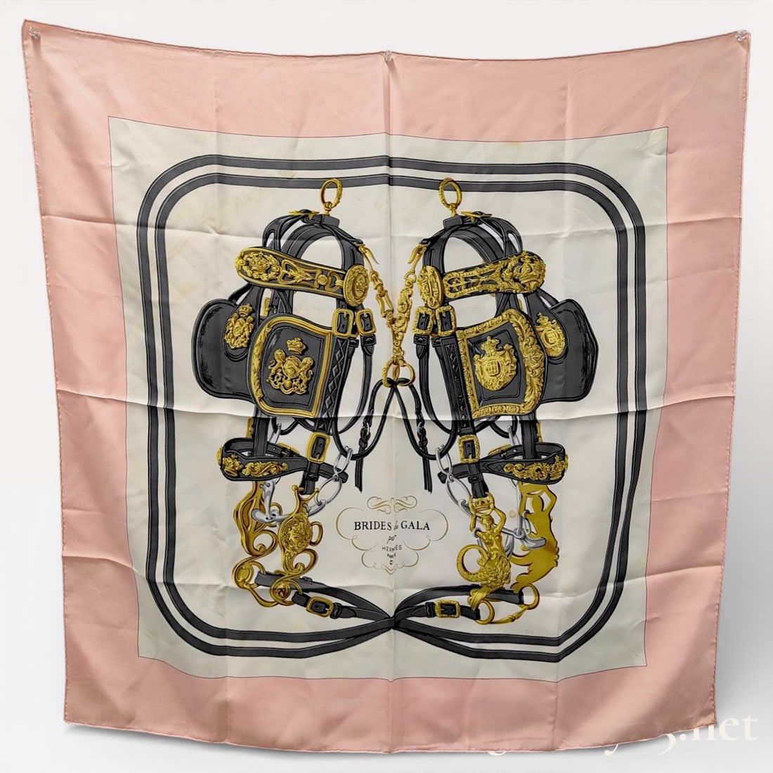 Hermes Silk Carre 90 Brides de Gala Scarf: An authentic Hermes silk twill Carre 90 scarf featuring the iconic Brides de Gala pattern designed by Hugo Grygkar. The design showcases two ornate ceremonial equestrian bridles in black and gold
