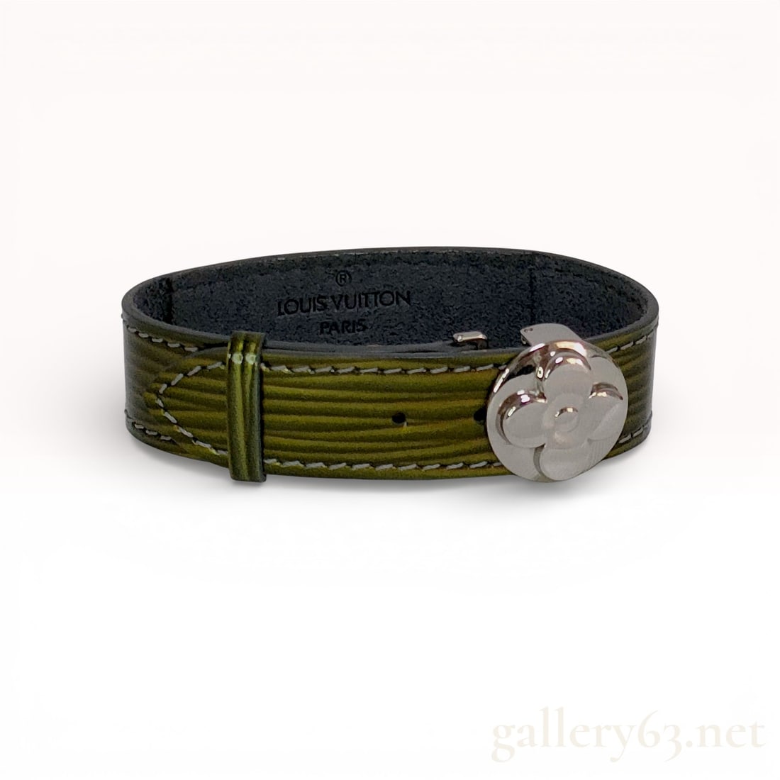 Silver-tone Metal and Green Cyber Epi Leather Louis Vuitton Good Luck Bracelet: A Louis Vuitton Good Luck bracelet, also known as the Millennium Wish model, featuring forest green Cyber Epi textured leather with white contrast stitching and silver-tone metal hardware. The