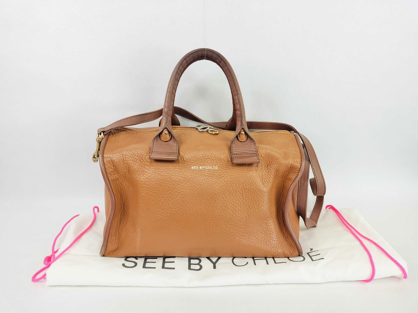 See By Chloé Nellie Two-Tone Pebbled Leather Satchel, Tan and Taupe: This See By Chloé Nellie two-tone satchel is crafted from a tan pebbled leather body complemented by taupe-brown smooth leather trim and handles. The exterior features a gold foil logo stamp ce