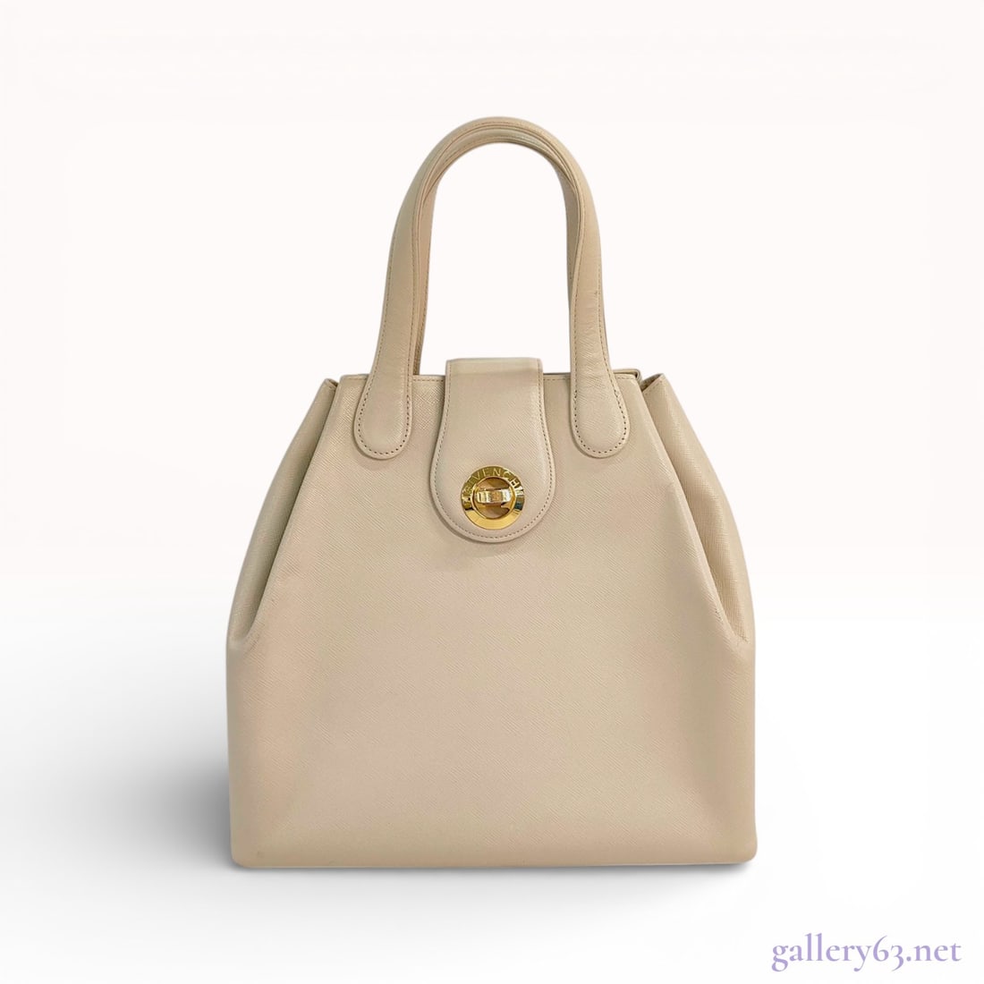 Givenchy Vintage Saffiano Leather Top Handle Bag, Beige: This vintage Givenchy handbag is crafted from durable cream-colored Saffiano leather featuring a structured trapezoidal silhouette. The design includes dual rolled leather top handles and a front flap
