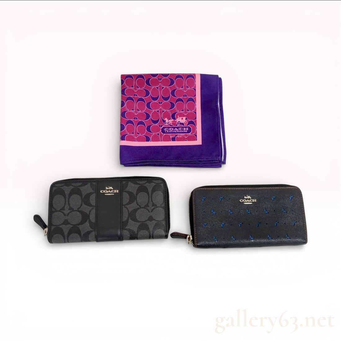 Three Coach Accessories including Signature and Butterfly Zip Wallets and Silk Scarf: This lot consists of three authentic Coach accessories. The first is an Accordion Zip Wallet in charcoal and black signature coated canvas with smooth leather trim and silver-tone hardware featuring a