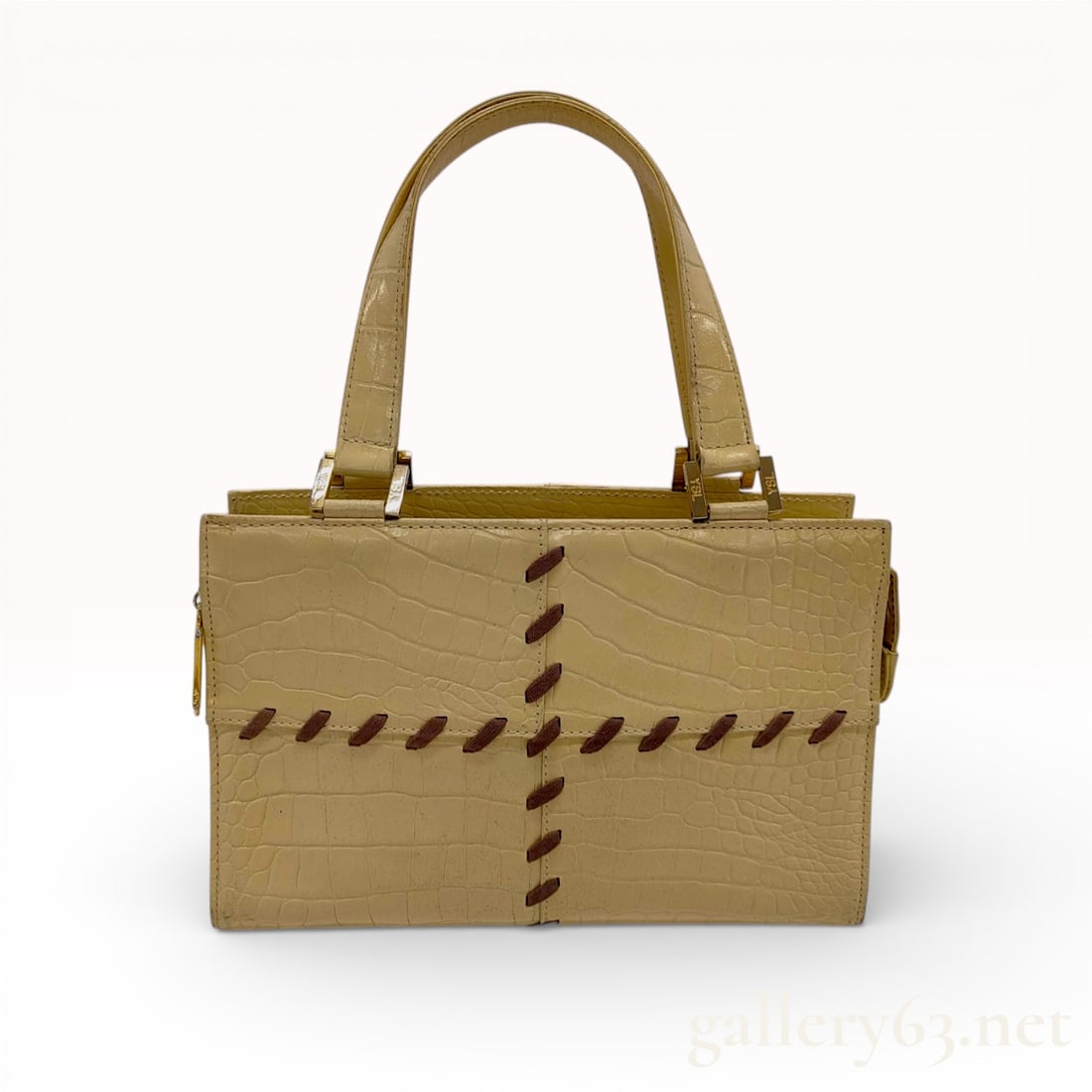 Yves Saint Laurent Vintage Croc-Embossed Leather Ribbon-Stitch Satchel, Cream: This vintage Yves Saint Laurent (YSL) satchel is crafted from cream-colored croc-embossed leather with a glossy finish. The exterior is detailed with a decorative chocolate brown fabric ribbon cross-s