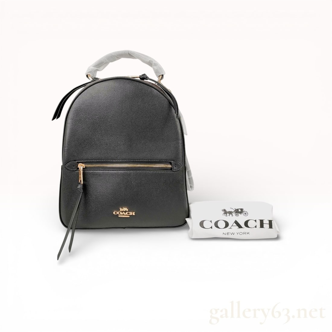 Coach Jordyn Backpack in Black Crossgrain Leather and Signature Canvas: This Coach Jordyn backpack is constructed from durable black crossgrain leather on the front, back, and base, accented by brown signature C coated canvas on the top and side gussets. The exterior feat