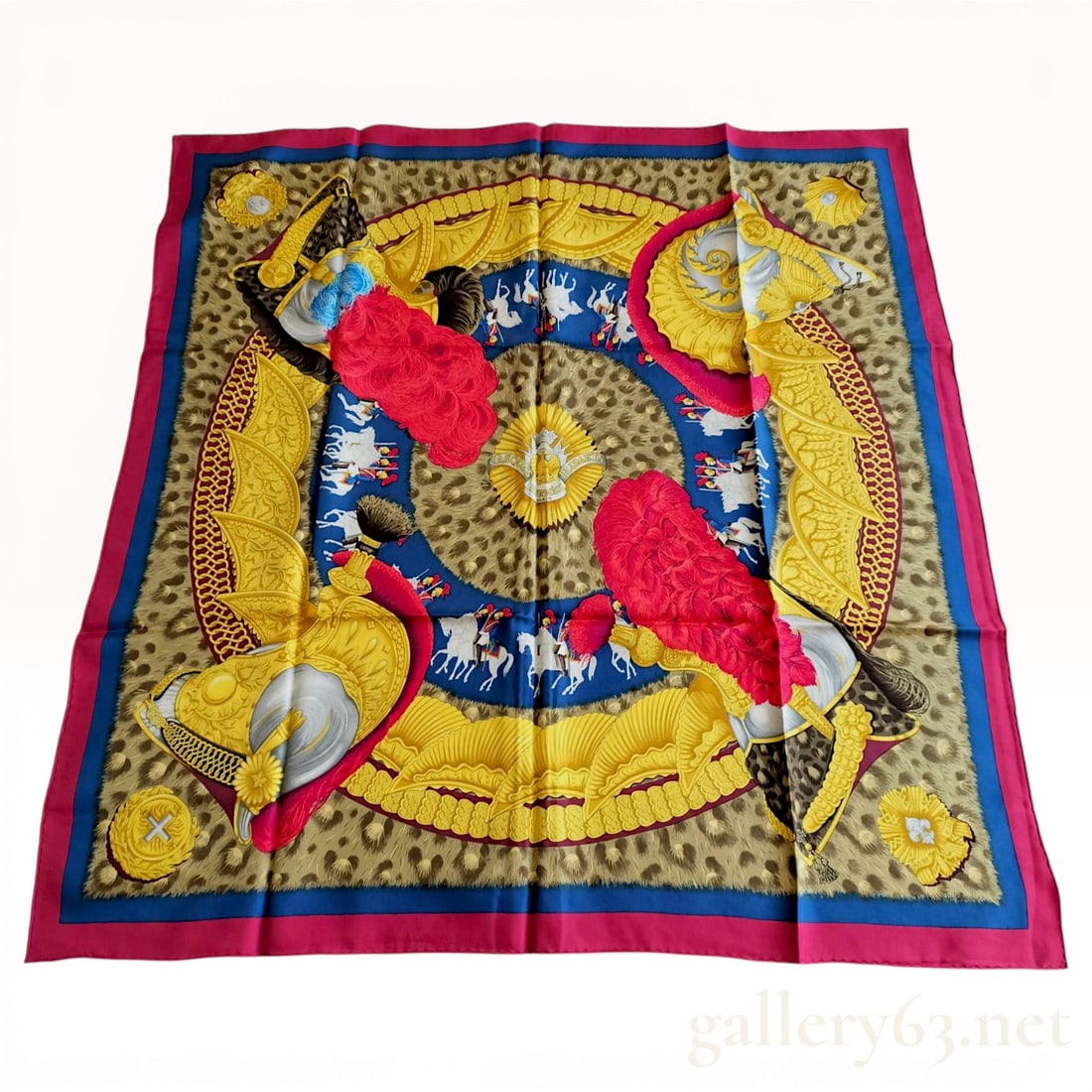 Hermes Silk Carre 90 Scarf, Casques et Plumets Pattern: This authentic Hermes silk twill scarf, titled Casques et Plumets (Helmets and Plumes), was designed by artist Julia Abadie and first issued in 1989. The intricate military-themed composition features