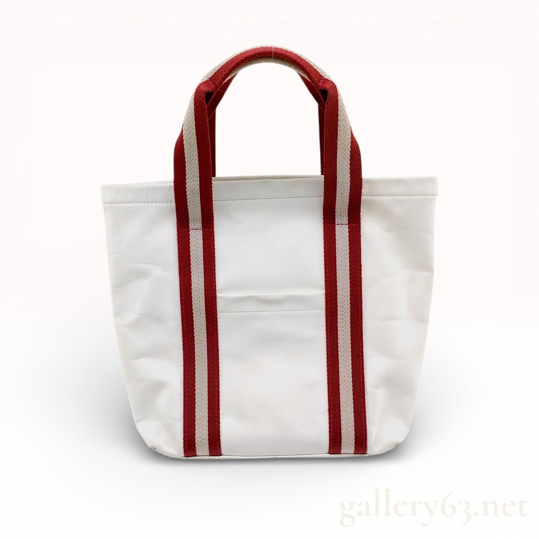 Bally Trainspotting Leather Stripe Tote Bag, White: This Bally tote bag is crafted from white grained leather and features the brand’s iconic red and cream striped webbing top handles, characteristic of the Trainspotting collection. The bag is design