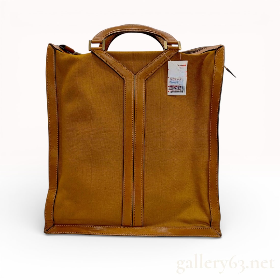 Yves Saint Laurent Bagages Vintage Y-Line Canvas and Leather Tote Bag: This vintage Yves Saint Laurent Bagages tote is a licensed Japanese production by Maruem. The bag features a structured, rectangular silhouette crafted from durable mustard yellow canvas with cognac l