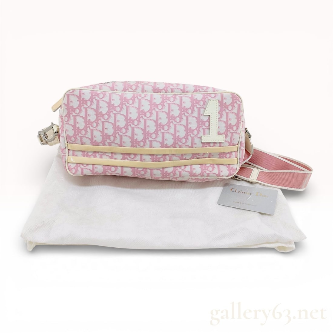 Christian Dior Girly Trotter Flight Bag Pink Monogram Canvas: This vintage Christian Dior flight bag is a signature piece from the early 2000s Girly collection, designed during John Galliano’s tenure. The exterior is crafted from pink Trotter monogram canvas w