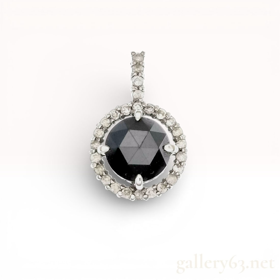 18K White Gold Black Rose-Cut Diamond Halo Pendant: This contemporary halo-style pendant is crafted in 18 karat white gold. The center features one round rose-cut black diamond weighing approximately 1.00 carat, secured in a four-prong double-claw