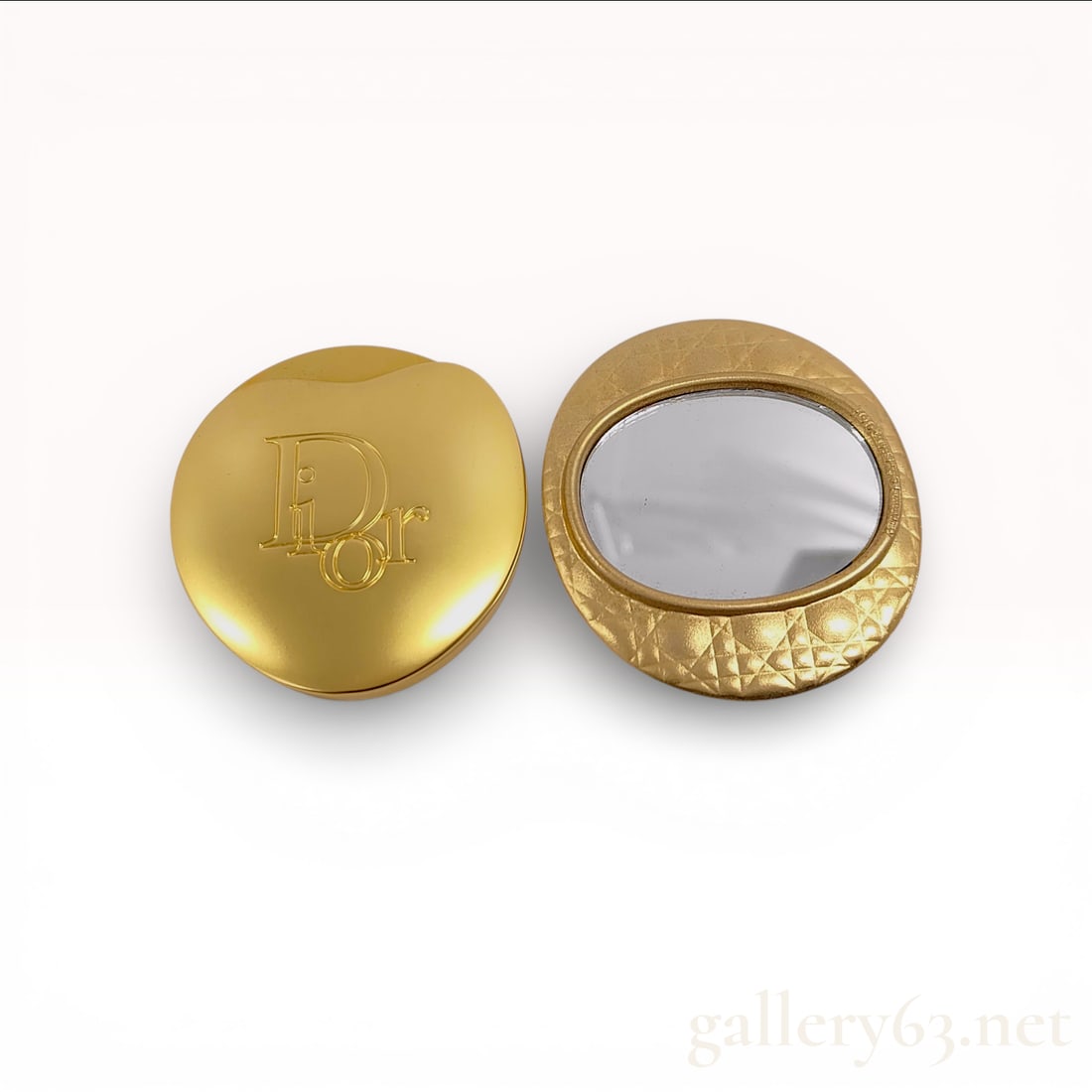 Christian Dior Vintage Gold-Tone Cannage Pattern Compact Mirror Set: A vintage handheld compact mirror set from Parfums Christian Dior. This two-piece accessory set is crafted from gold-tone metal and consists of a separate lid and a mirror base designed to be stored
