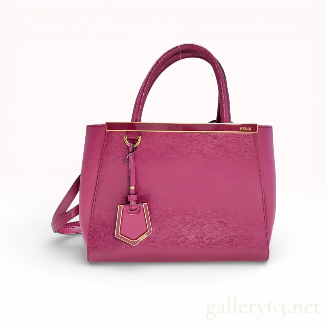 Fendi Petite 2Jours Saffiano Leather Tote Bag, Magenta: This authentic Fendi Petite 2Jours tote is crafted from magenta textured Saffiano leather with tonal smooth leather side panels. The bag features the signature logo-engraved gold-tone metal top bar