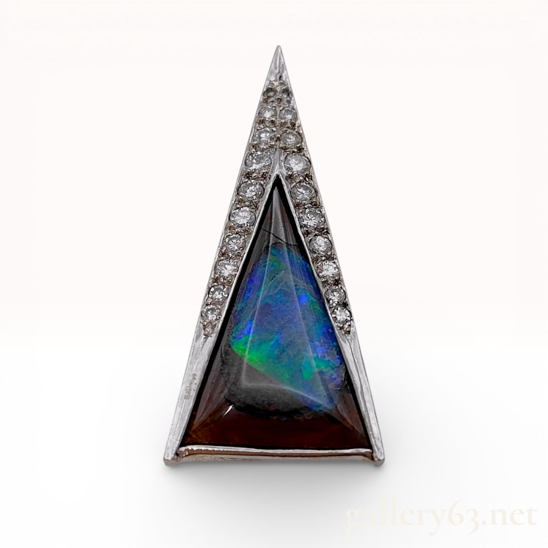18k White Gold Boulder Opal and Diamond Geometric Pendant, Bunda: A contemporary 18k white gold pendant by Bunda, designed as an elongated isosceles triangle. The center features a triangular-cut boulder opal with a dark brown ironstone matrix and vibrant electric