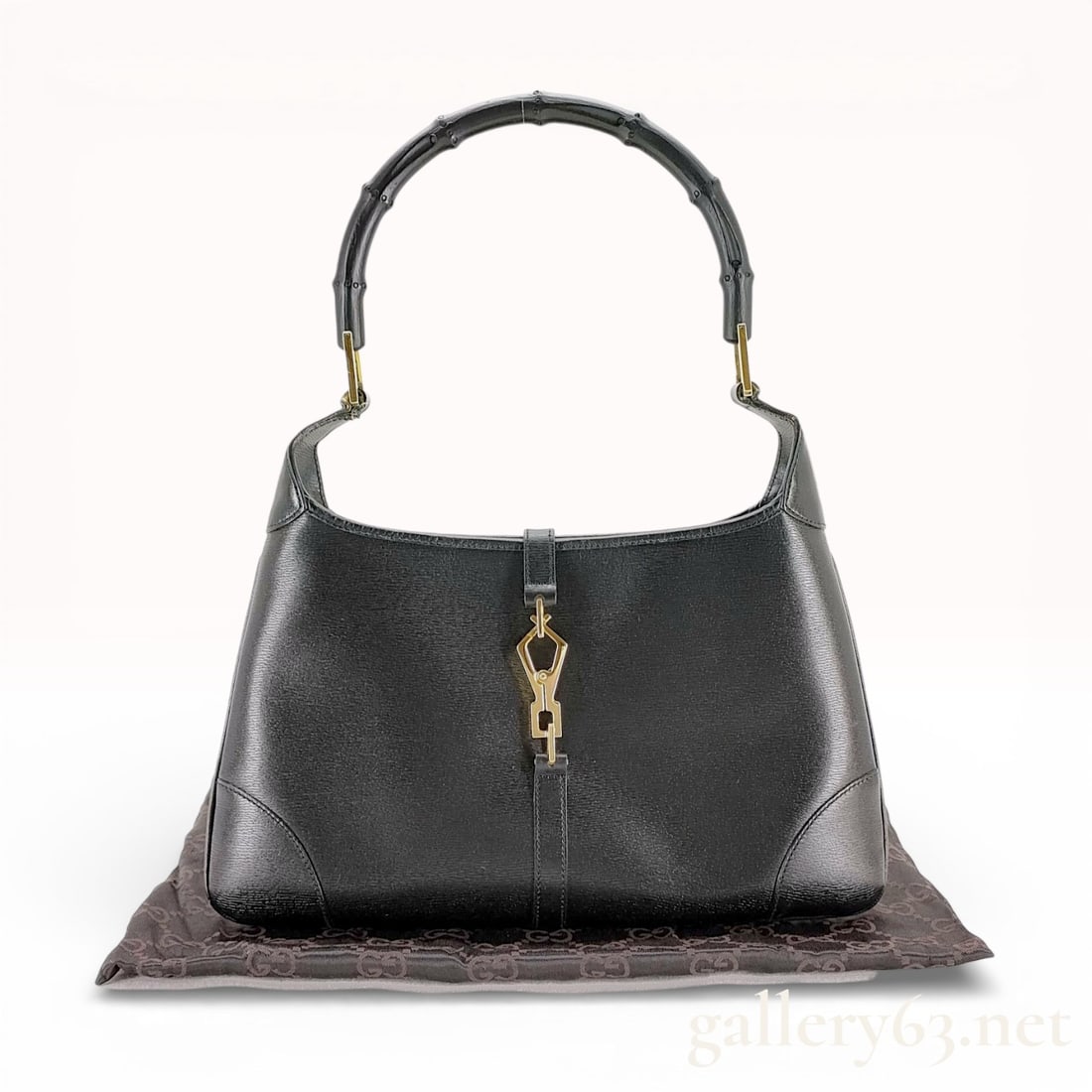 Gucci Jackie Hobo Bag, Black Leather with Bamboo Handle: This Gucci Jackie hobo bag is crafted from black textured leather and features the brand's signature lacquered bamboo handle. The exterior is accented with gold-tone hardware, including the iconic