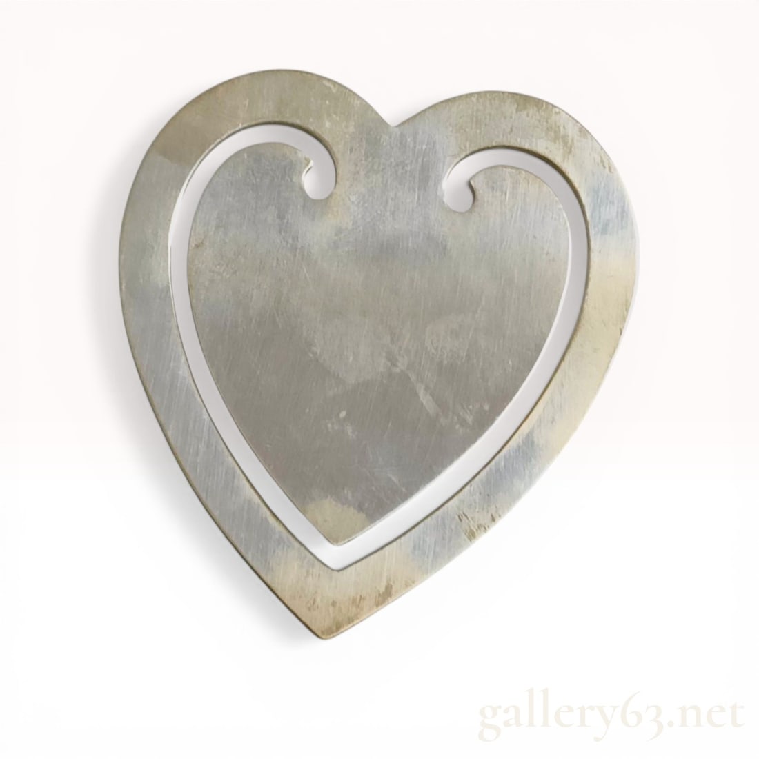 Tiffany & Co. Sterling Silver Large Heart Bookmark: Tiffany & Co. sterling silver bookmark in a stylized heart pattern, late 20th century. Crafted from a single sheet of solid .925 sterling silver, the design features a precision-cut internal scrol