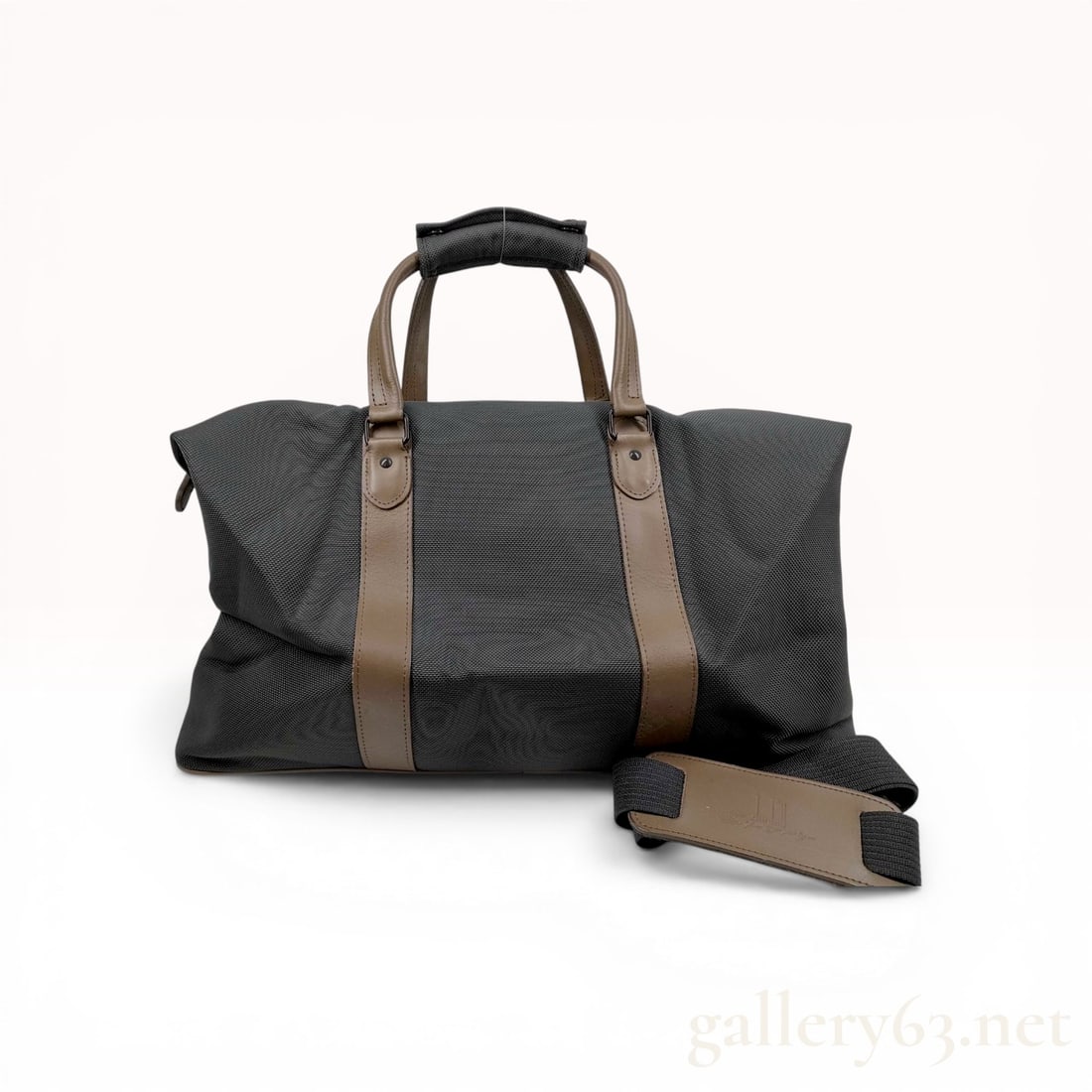 Dunhill Boston Travel Duffel Bag in Charcoal Gray Textile and Brown Leather: Dunhill Boston-style travel duffel bag featuring a charcoal gray textured textile body with olive-brown leather trim. The exterior is detailed with vertical leather bands, gunmetal-toned hardware, a h