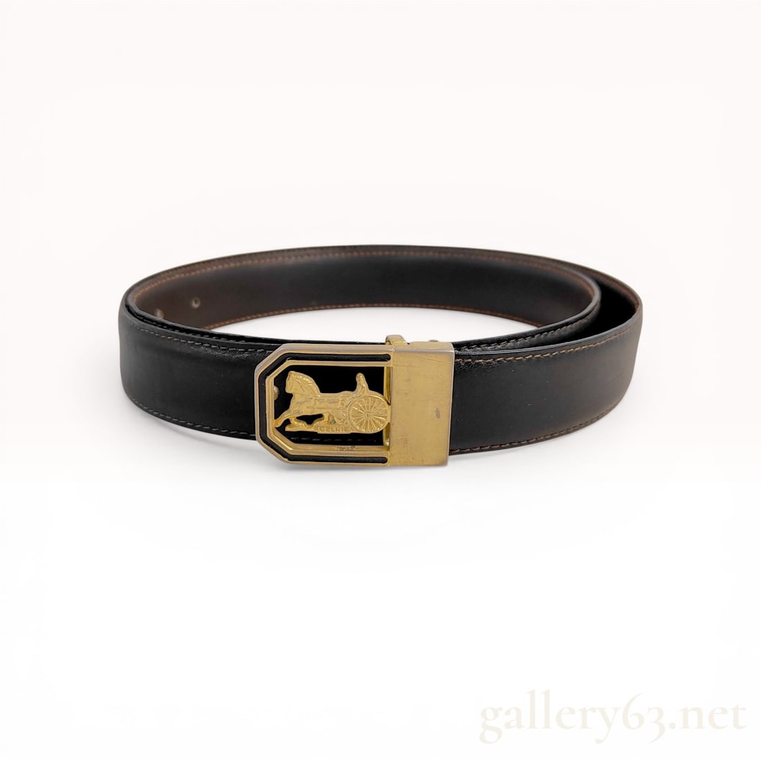 Celine Vintage Sulky Horse and Carriage Leather Belt: Vintage Celine leather belt featuring the signature Sulky horse and carriage motif. The black leather strap is constructed with brown contrast topstitching and a gold-tone metal buckle with a black in