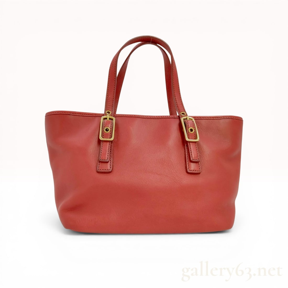 Coach Red Glove-Tanned Leather Legacy Market Tote Style 9846: Coach Legacy Market Tote, style number 9846, crafted from red glove-tanned cowhide leather with brass-tone hardware. The design features dual flat top handles adjustable via buckles, a recessed zip-to