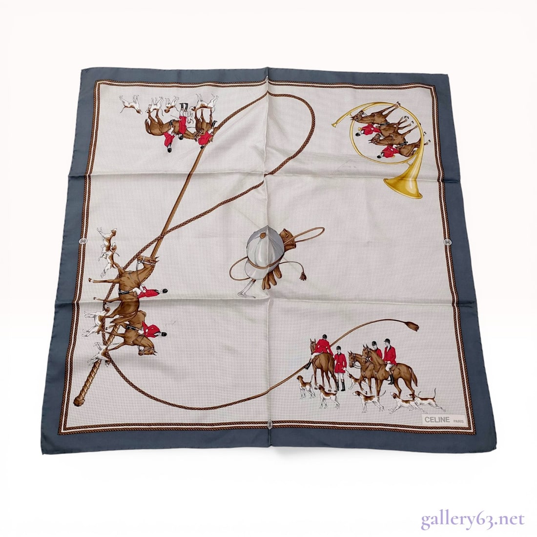 Celine Paris Equestrian Motif Silk Scarf: Celine Paris square silk scarf featuring an equestrian and fox hunting motif. The design includes hunters in red coats, hounds, a hunting horn, and riding equipment set against a light gray