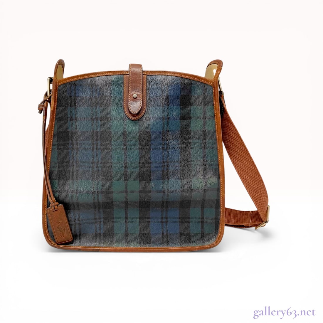 Vintage Ralph Lauren Black Watch Plaid Coated Canvas Messenger Bag: Vintage Ralph Lauren messenger bag featuring the signature Black Watch tartan plaid pattern in coated canvas. The design includes cognac brown leather trim, a top tab closure with a metal stud, and