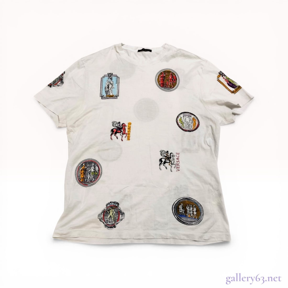 Versace Neoclassical Graphic Print Cotton T-Shirt, Size 2XL: Versace short-sleeve crewneck T-shirt, circa 2017. White cotton jersey featuring an all-over print of multicolored neoclassical medallions, equestrian figures, and Greco-Roman vignettes. Interior labe