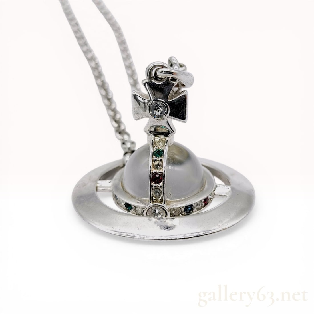 Vivienne Westwood Silver-Tone Medium Orb Pendant Necklace: Vivienne Westwood silver-tone orb pendant necklace featuring a clear central orb accented by multi-colored crystals. The pendant is suspended from a double-strand rolo chain with a lobster claw clasp