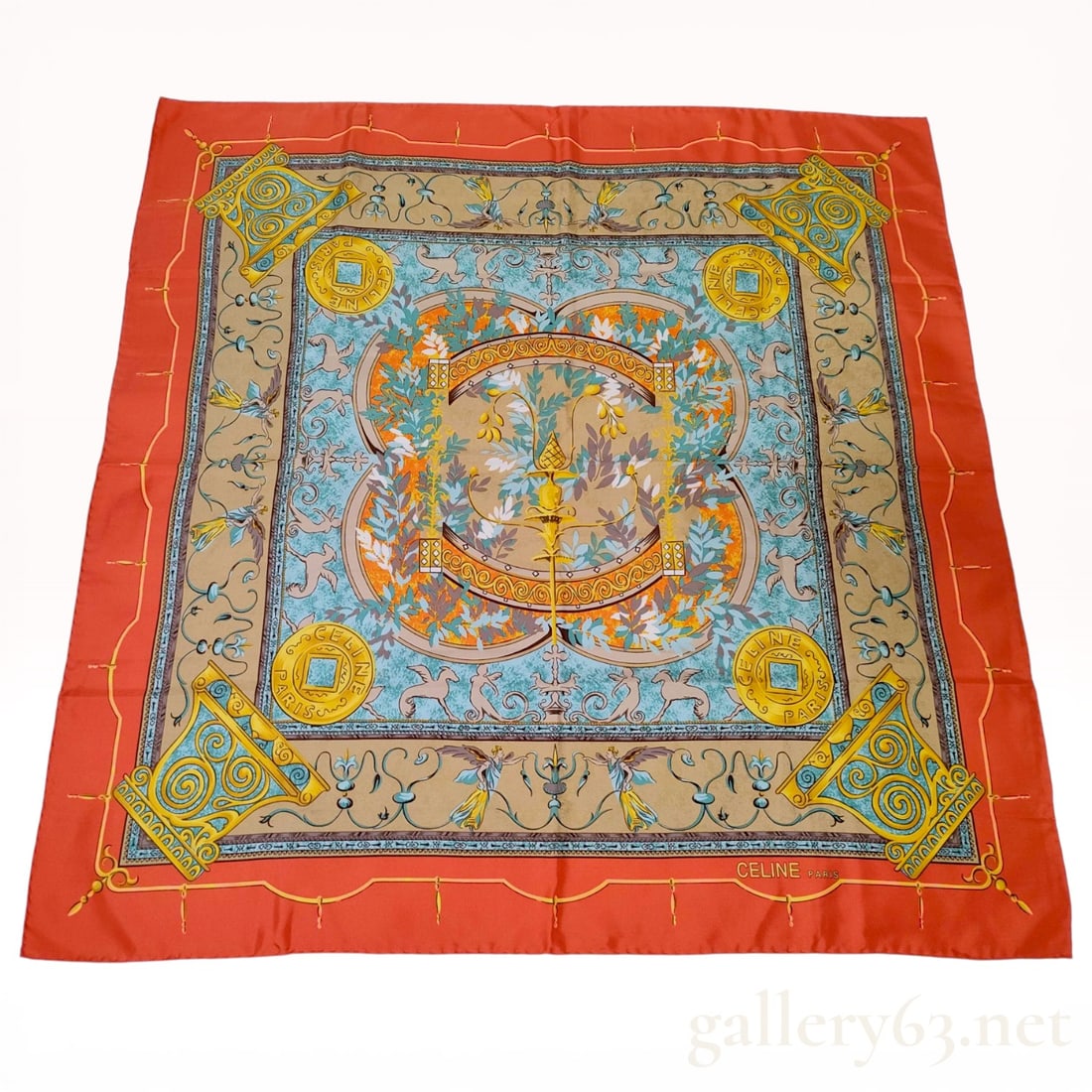 Celine Paris Neoclassical Motif Silk Scarf: Celine Paris square silk scarf featuring a Neoclassical print with urns, winged griffins, and golden medallions. The composition includes a central laurel wreath field on a light blue and tan ground,