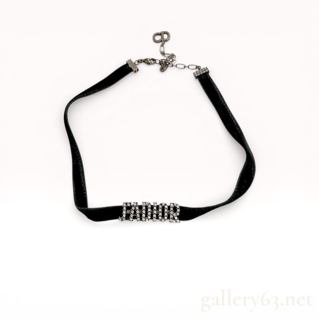 Christian Dior J'Adior Crystal and Black Velvet Choker Necklace: Christian Dior J'Adior choker necklace featuring a central crystal-set script logo on a black velvet ribbon. The silver-tone metal hardware includes crystal-encrusted end caps, a lobster claw clasp, a