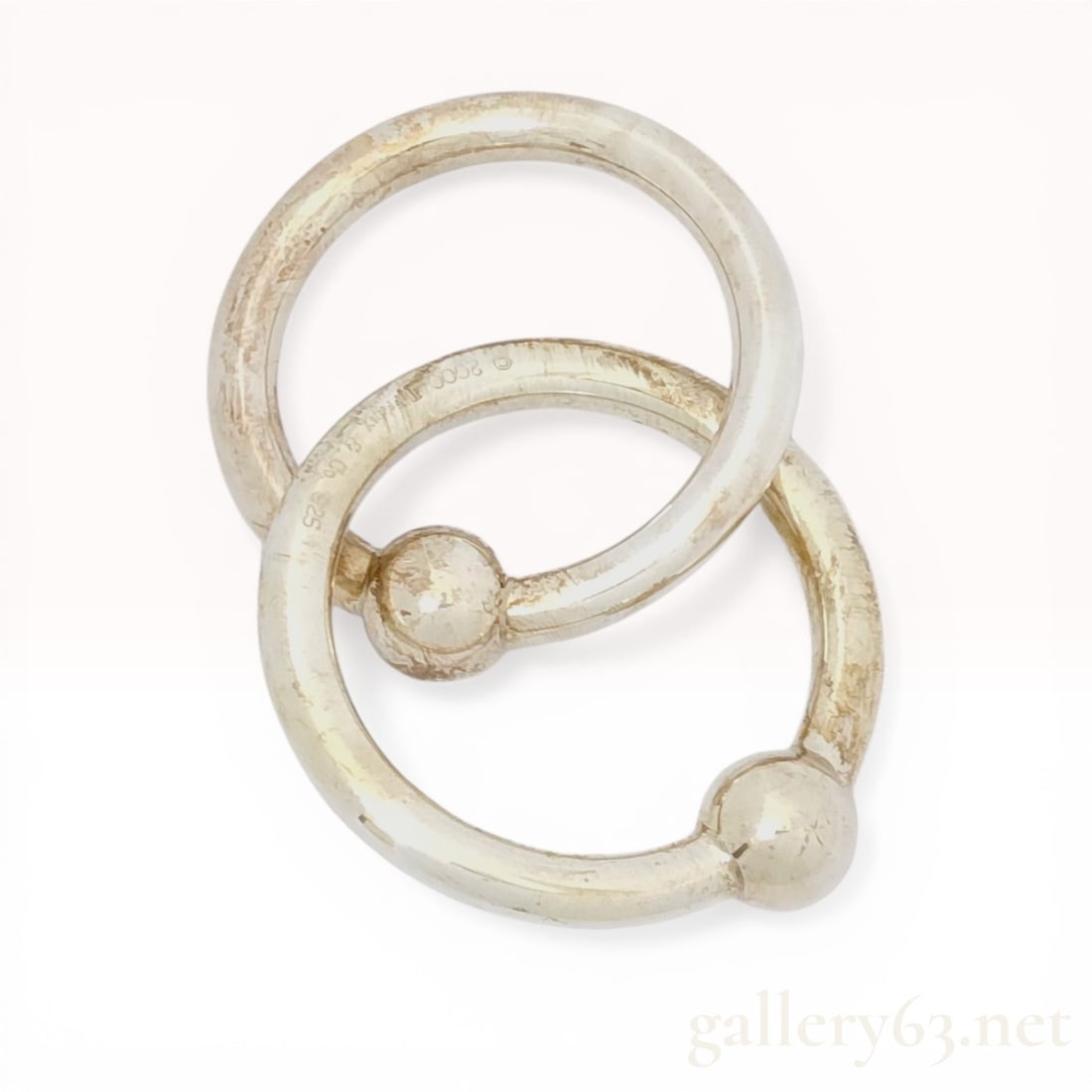A Pair of Tiffany and Co. Sterling Silver Interlocking Baby Teething Rings (1 of 9)