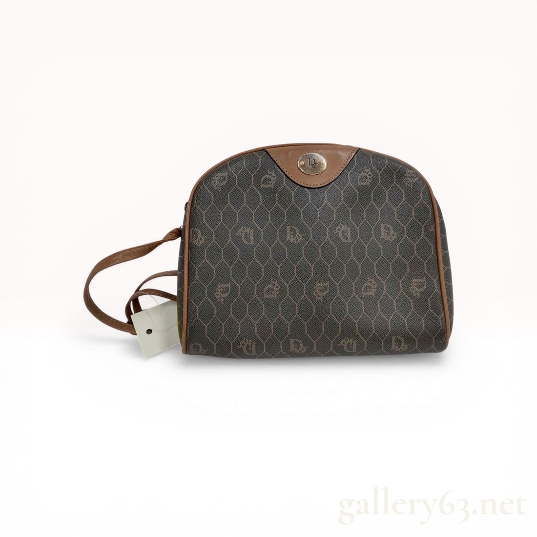 Christian Dior Vintage Honeycomb Monogram Coated Canvas Crossbody Bag: Christian Dior vintage crossbody bag in the honeycomb monogram pattern, circa late 20th century. The bag is crafted from charcoal gray coated canvas with brown leather piping and a slender leather sho