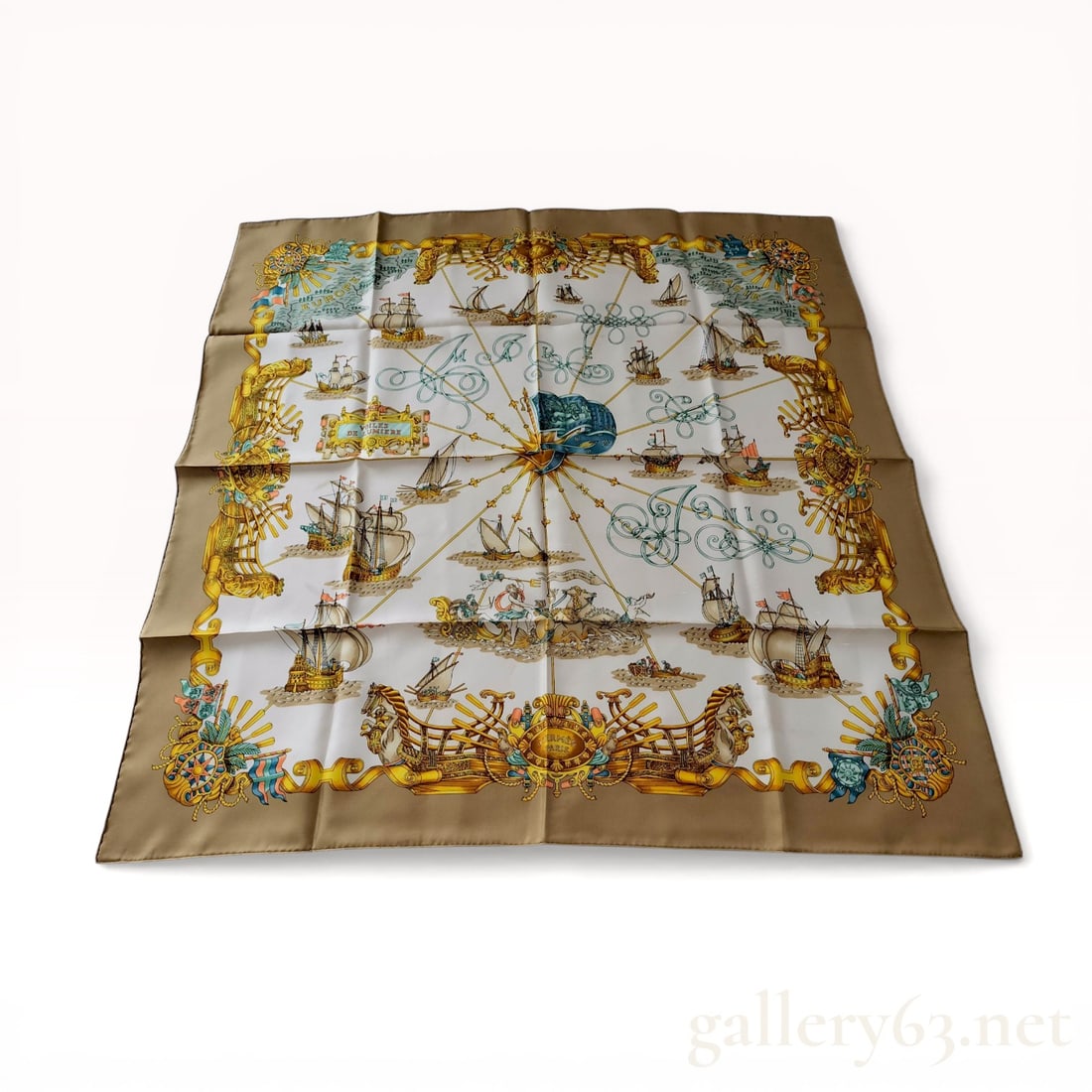 Herm?¨s Voiles de Lumi?¨re Silk Scarf by Joachim Metz: Hermès silk twill scarf in the Voiles de Lumière pattern, designed by Joachim Metz. The nautical composition features historical sailing vessels distributed around a central golden compa