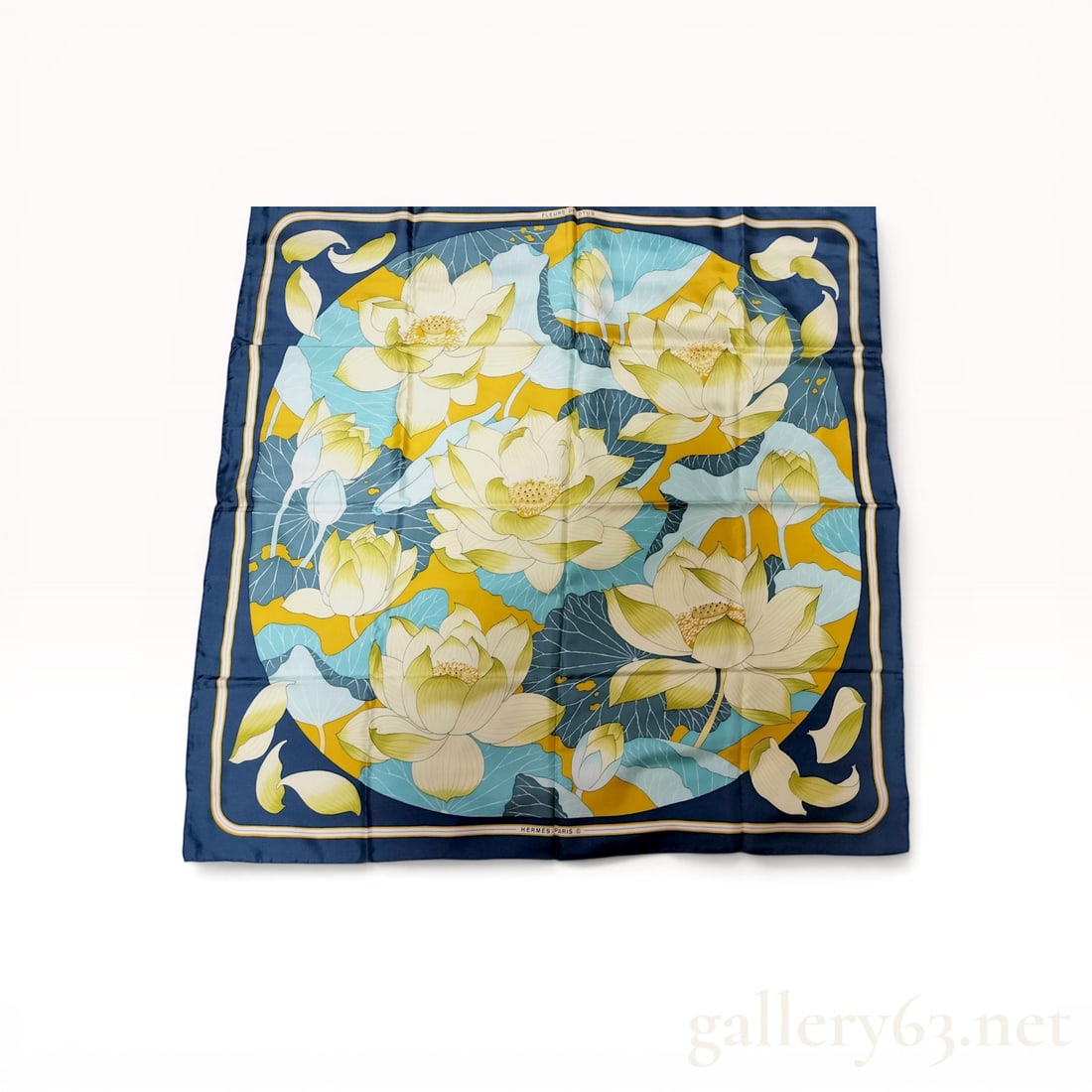 Herm?¨s Fleurs de Lotus Silk Carr?© Scarf: Hermès silk carré scarf in the Fleurs de Lotus pattern, originally designed by Christiane Vauzelles circa 1976. The 100% silk twill fabric features a central circular medallion of lotus