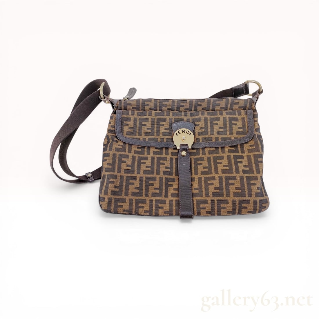 Fendi Zucca Canvas Shoulder Bag: Vintage Fendi shoulder bag in tobacco and dark brown Zucca monogram jacquard canvas with leather trim. Features a front flap with a gold-tone turn-lock logo plate, adjustable canvas webbing strap, and