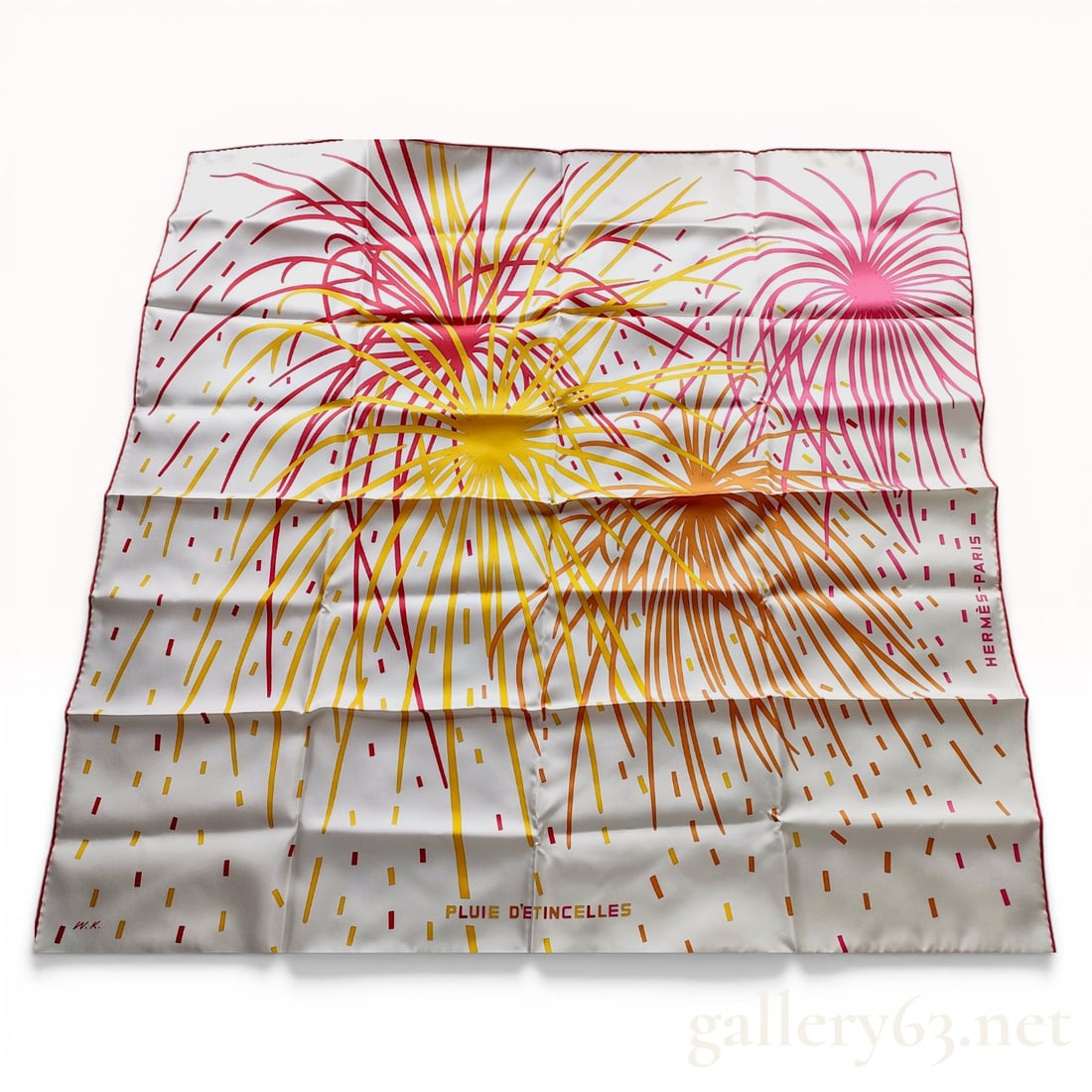 Herm?¨s Pluie d'?‰tincelles Silk Scarf by W?‚odzimierz Kaminski: Hermès silk twill scarf in the Pluie d'Étincelles pattern, designed by artist W?‚odzimierz Kaminski. The graphic composition depicts stylized fireworks in vibrant pink, yellow, orange,