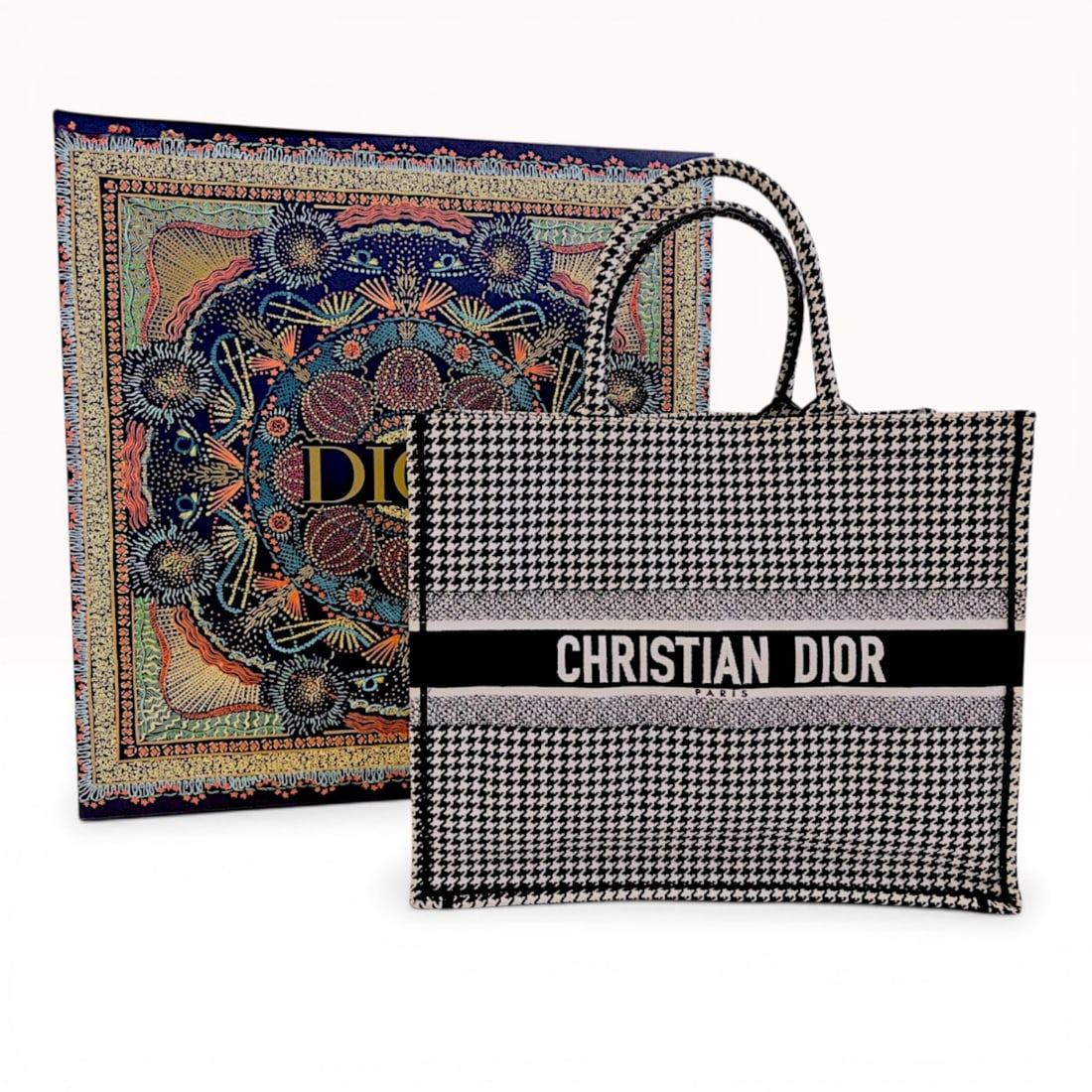Christian Dior Medium Book Tote in Black and White Houndstooth Embroidered Canvas: Christian Dior Medium Book Tote, contemporary. Structured tote featuring a full-surface black and white embroidered houndstooth pattern with a horizontal Christian Dior Paris signature band. The unlin