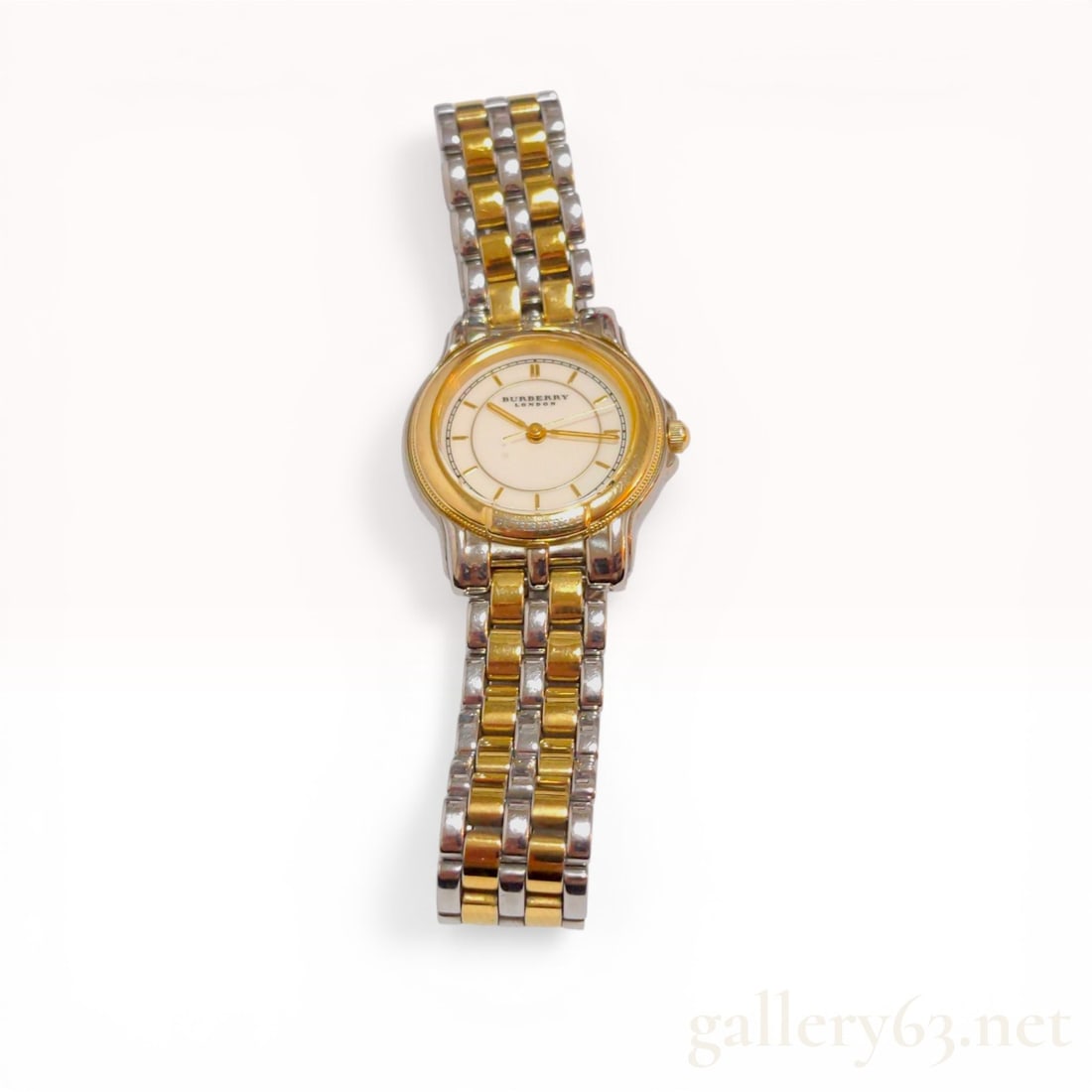 Burberry London Two-Tone Ladies Quartz Wristwatch Reference 6031-G13435: Burberry London ladies wristwatch, reference 6031-G13435, featuring a Japanese quartz movement. The watch is constructed with a two-tone stainless steel and gold-tone plated case and a multi-link brac