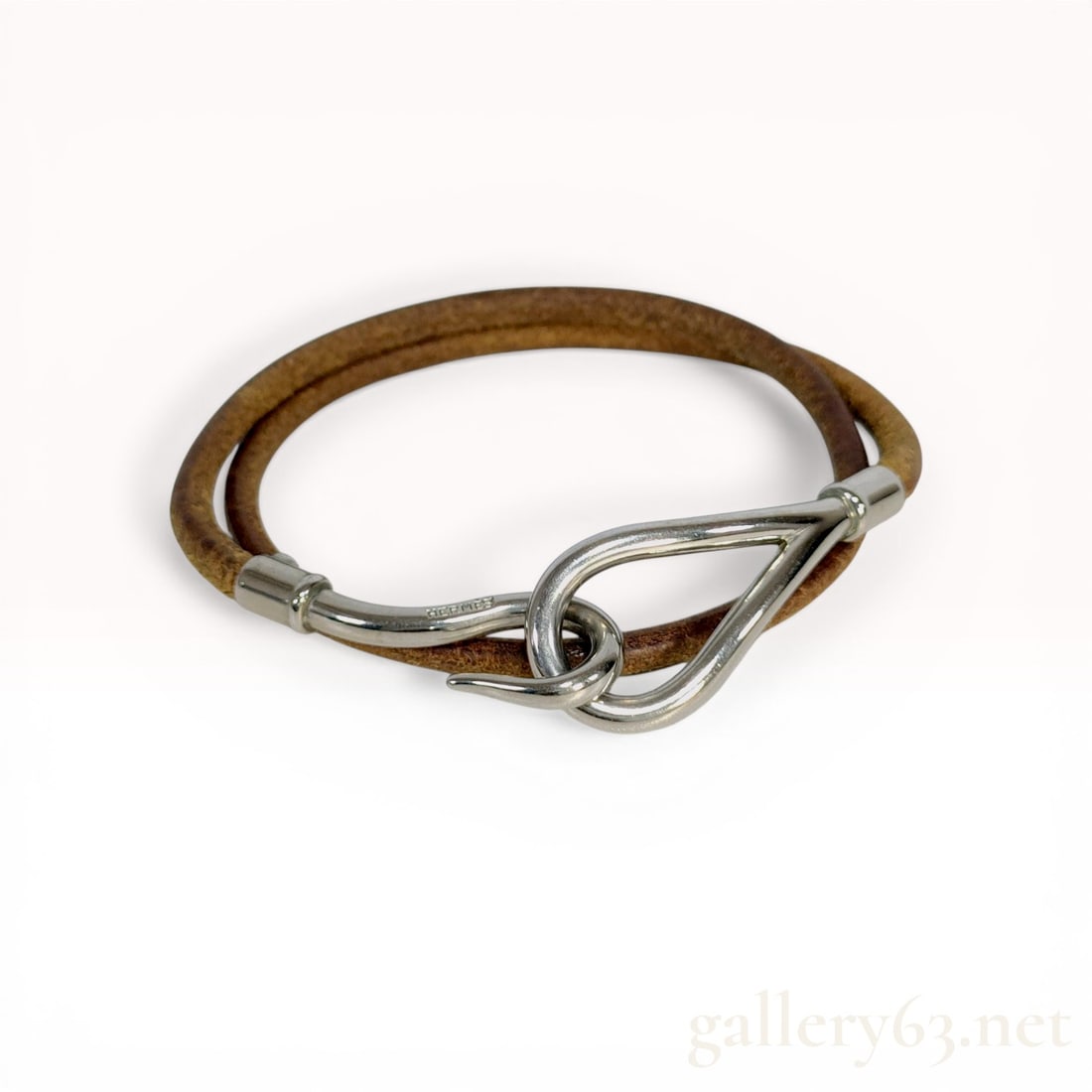 Herm?¨s Jumbo Double Tour Leather Bracelet: Hermès Jumbo Double Tour bracelet featuring a brown leather cord and silver-tone hardware. The design consists of a double-wrap cord secured by a signature hook and loop clasp. The hook element