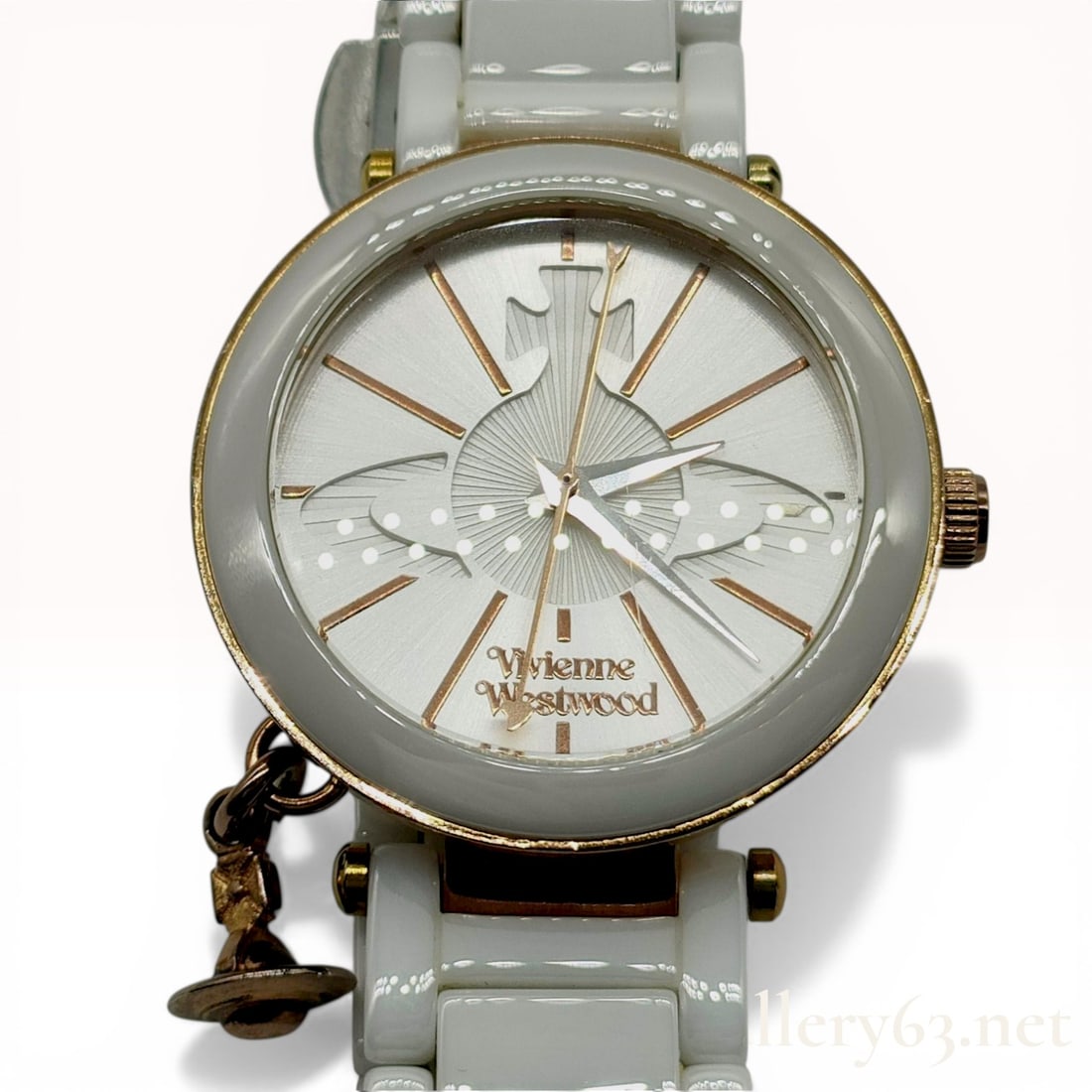 Vivienne Westwood Ceramic Orb Charm Women's Watch VV067RSWH: Vivienne Westwood Ceramic Orb Charm wrist watch, reference VV067RSWH, featuring a Swiss quartz movement. The design includes a rose gold-tone stainless steel case with a white ceramic bezel, a texture