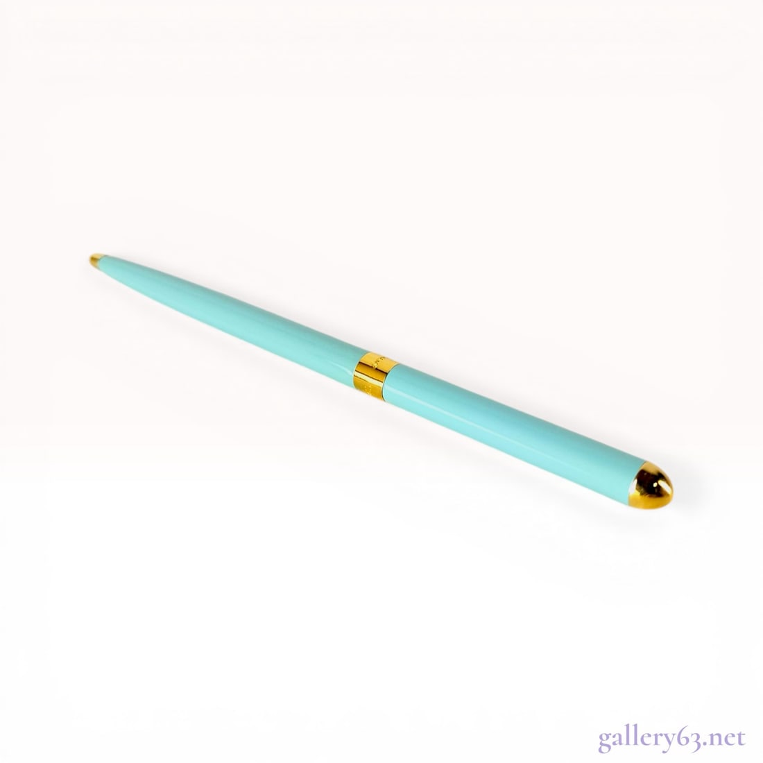 Tiffany and Co. Blue Lacquer Perspen Slim Purse Pen: Tiffany and Co. Perspen ballpoint purse pen, manufactured in West Germany prior to 1990. The slim cylindrical barrel is finished in signature Tiffany Blue lacquer with polished gold-tone hardware and