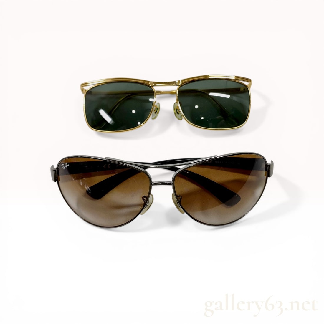 Two Pairs of Metal Frame Sunglasses including Ray-Ban RB 3386: Ray-Ban RB 3386 sunglasses and a pair of unmarked gold-toned metal frame sunglasses. The Ray-Ban pair features gunmetal-toned frames with brown gradient lenses and black plastic temples, while the sec