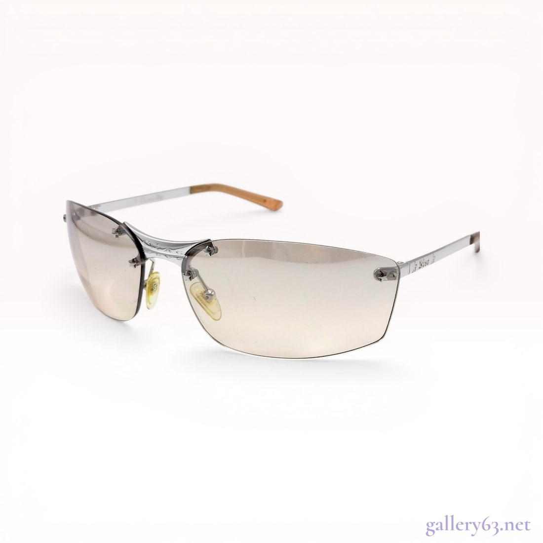 Christian Dior Pop/N Rimless Sunglasses: Christian Dior Pop/N rimless sunglasses, model YB7KH, manufactured in Italy. The design features rectangular wrap-around lenses with a light brown gradient tint secured to silver-toned metal hardware