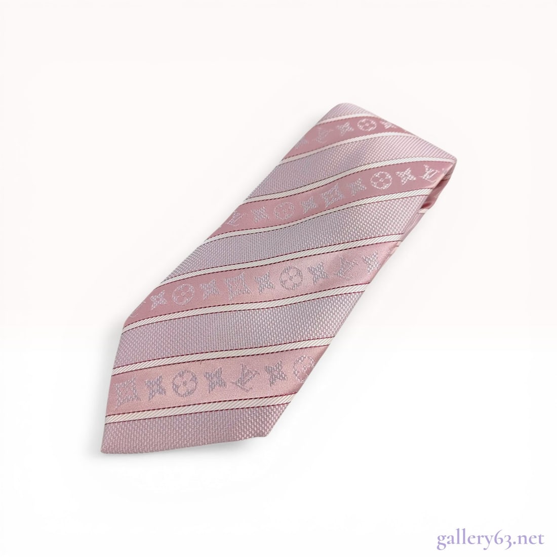 Louis Vuitton Monogram Striped Silk Necktie: Louis Vuitton silk necktie, modern. Diagonal striped pattern in pink and lavender featuring jacquard-woven Monogram motifs and a tonal Damier lining. Marked Louis Vuitton Paris on the keeper loop with